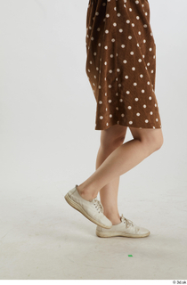 Aera  1 brown dots dress casual dressed flexing leg…